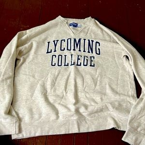 Woman’s size XL sweatshirt light tan and cut in a v-shape at neck gear brand.